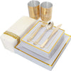A set of gold plastic dinnerware, including plates and cutlery, is displayed on a white tray.