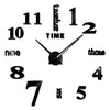 A black and white analog clock face showing the time as eleven o'clock.