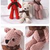 Three crocheted teddy bears in red, beige, and pink with brown bows displayed on a white background.