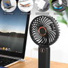 A portable rechargeable handheld fan with a digital display is shown next to various charging options.