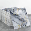 A sheet of self-adhesive marble tile stickers featuring gray and black marble patterns with gold veining.
