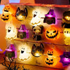 A display of battery-operated Halloween string lights featuring various seasonal motifs like cats, ghosts, skulls, and pumpki