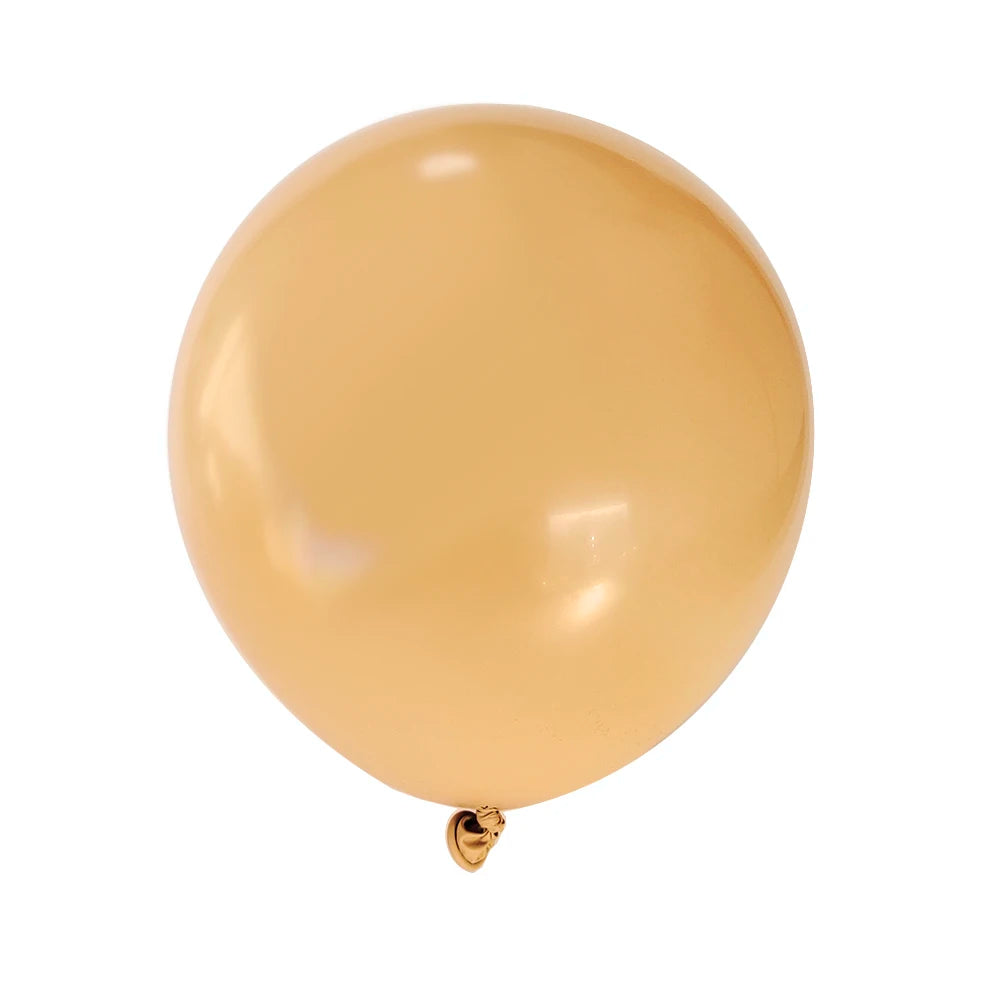 A single matte latex balloon in a pale golden yellow color.