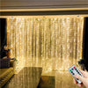 LED curtain string lights illuminating a sheer fabric backdrop in a room.
