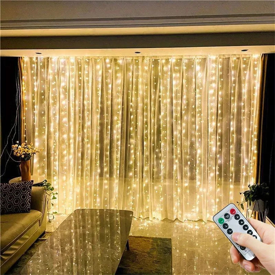LED curtain string lights illuminating a sheer fabric backdrop in a room.