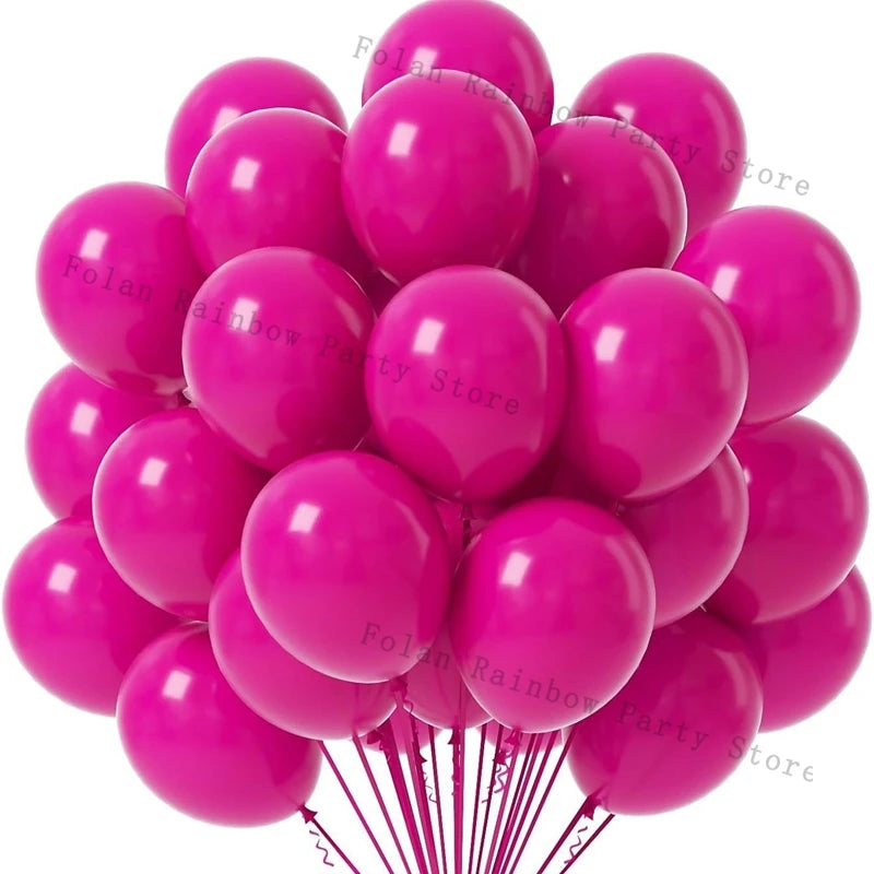A cluster of matte pink latex balloons tied on a string, used for a party decoration.