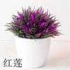 Un vibrant arbre bonsai artificiel violet dans un pot blanc.