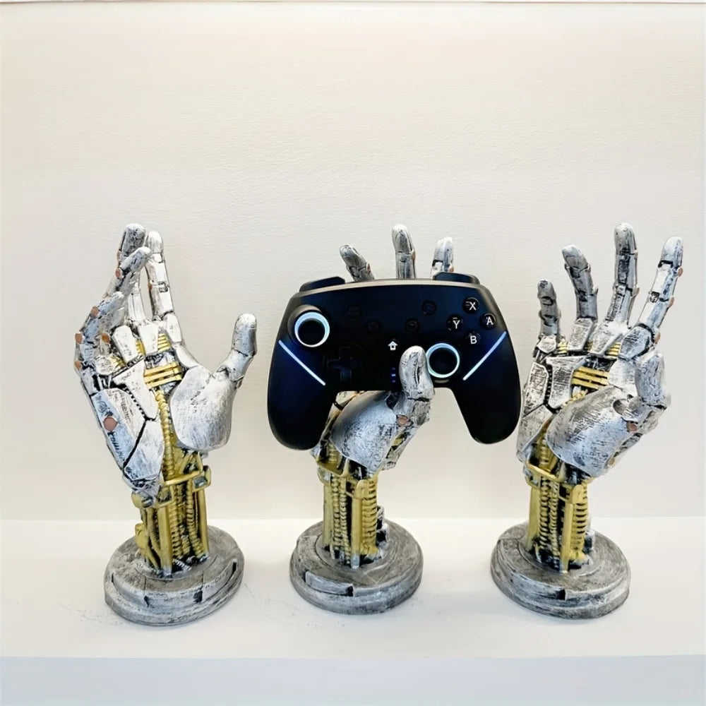 A display of three hand-shaped metal organizers designed to hold a 3D gamepad or controller.