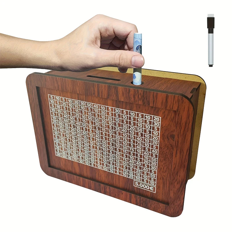 A hand places a coin into a wooden savings box featuring a progress tracker and a vertical display.