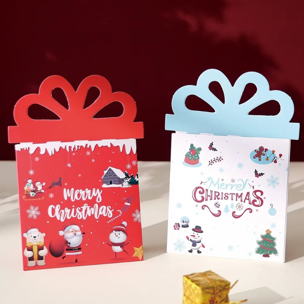 A set of three red and blue cartoon Christmas thank you cards with festive designs displayed on a white surface.