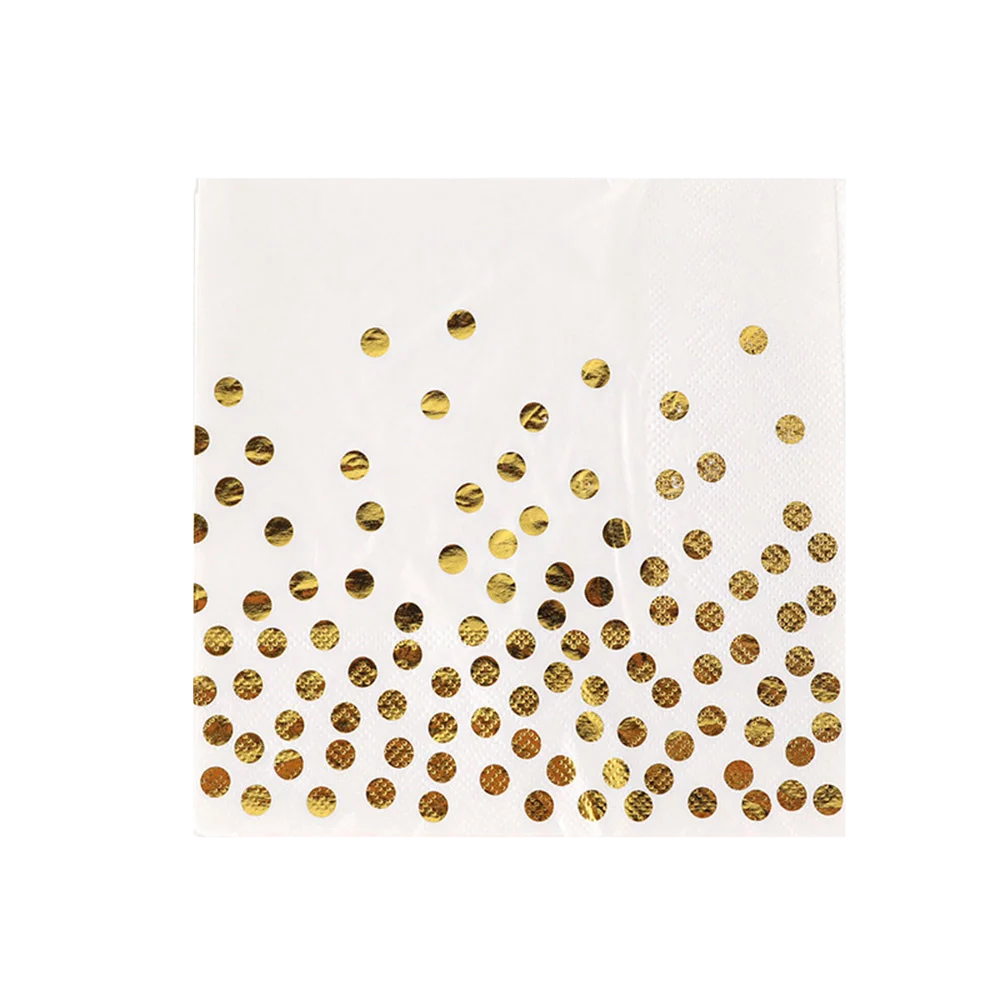 Juego de vajilla desechable blanco con lunares dorados.