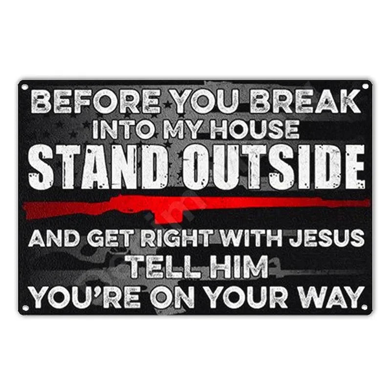A black metal wall sign with white text that reads Before you break into my house stand outside and get right with Jesus tell