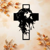 Black silhouette of a crown of thorns cross design on a light background with autumn leaves