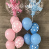 A collection of foil balloons featuring a pink bear and a blue bear boy, along with solid light blue and pink balloons.