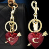 Colgante y cadena con dije en forma de corazón dorado con acabado brillante rojo