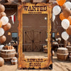 A rustic wooden photo booth prop featuring a WANTED banner and a reward sign for $10000
