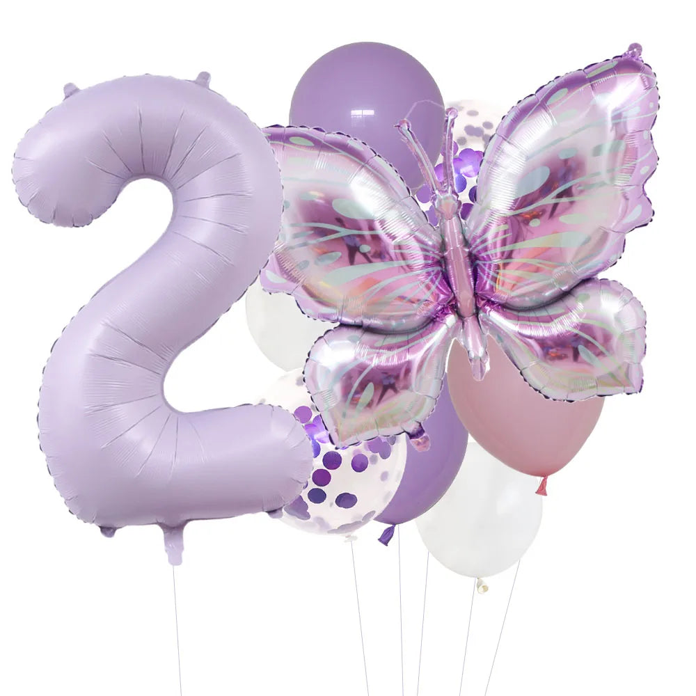 A set of purple butterfly foil balloons shaped like the number two and a round balloon.