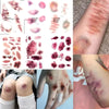 A collection of realistic bruise and scar temporary tattoos showing various shades and patterns on skin.