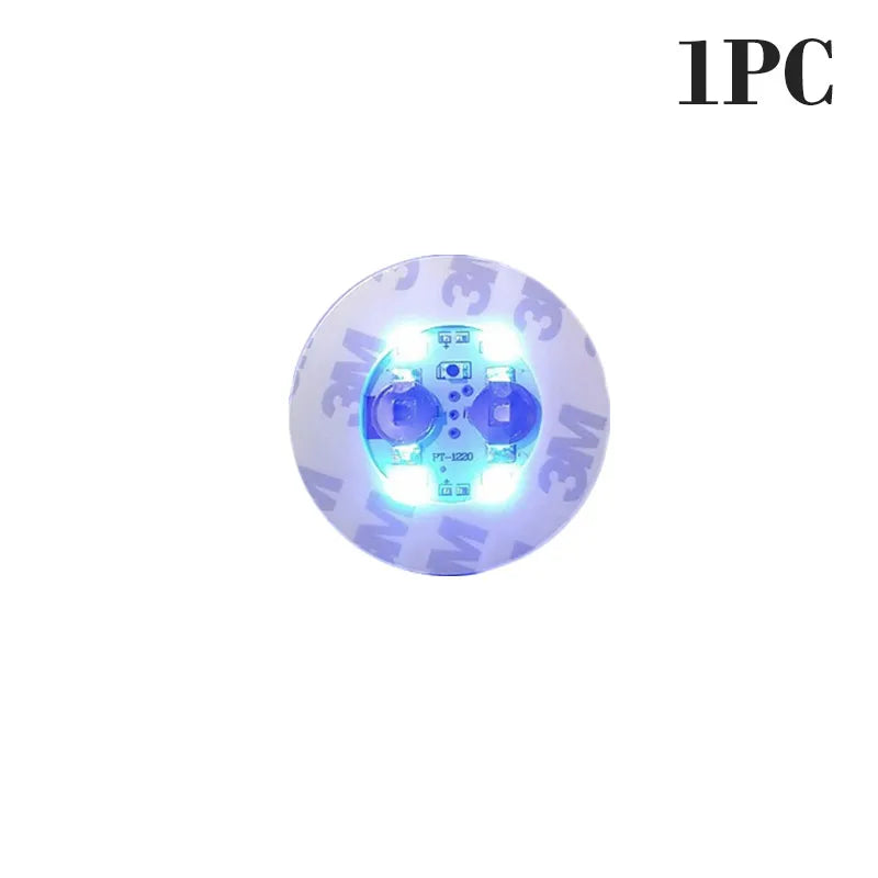 A single luminous LED coaster light featuring a blue glow and multiple light elements.