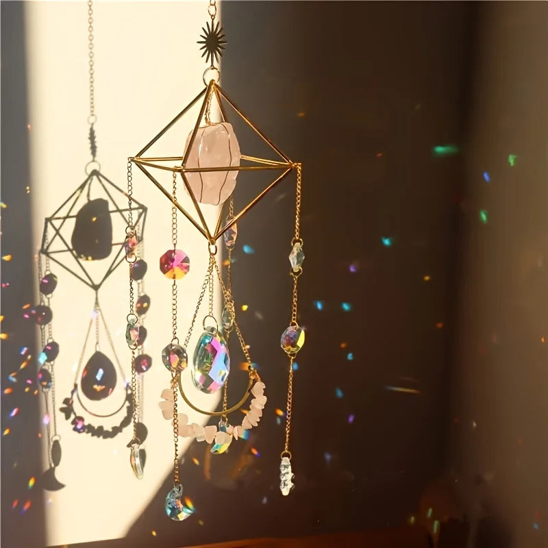 A hanging crystal sun catcher with geometric gold frame and various colored crystals.