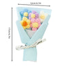 A bouquet of handmade crochet flowers in various pastel colors including blue, yellow, and pink, wrapped in light blue paper.