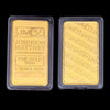 Two rectangular gold bullion ingots labeled Johnson Matthey Fine Gold 9999 1 ounce Troy