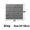 Grey self-adhesive 3D foam wall panels measuring 35 by 30 centimeters