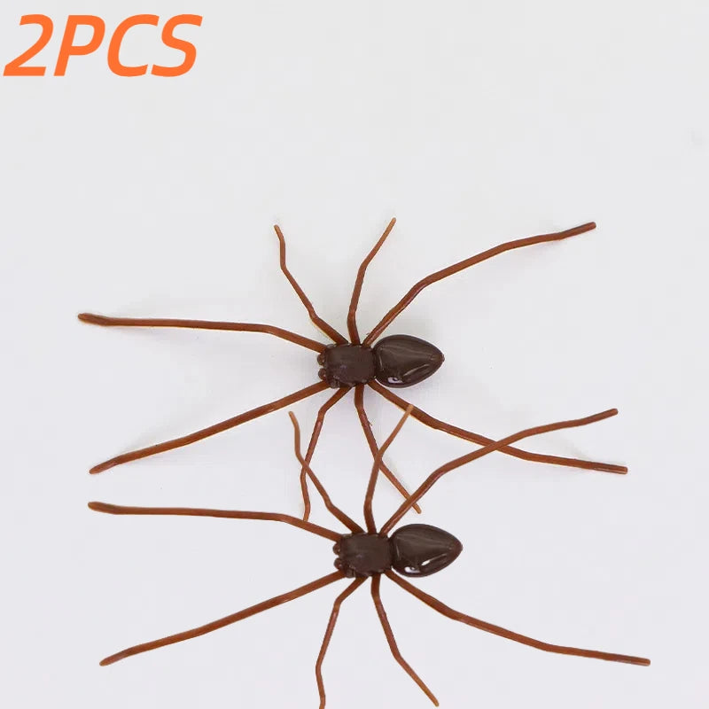 A set of two realistic brown spiders used as fridge magnets or horror decor.