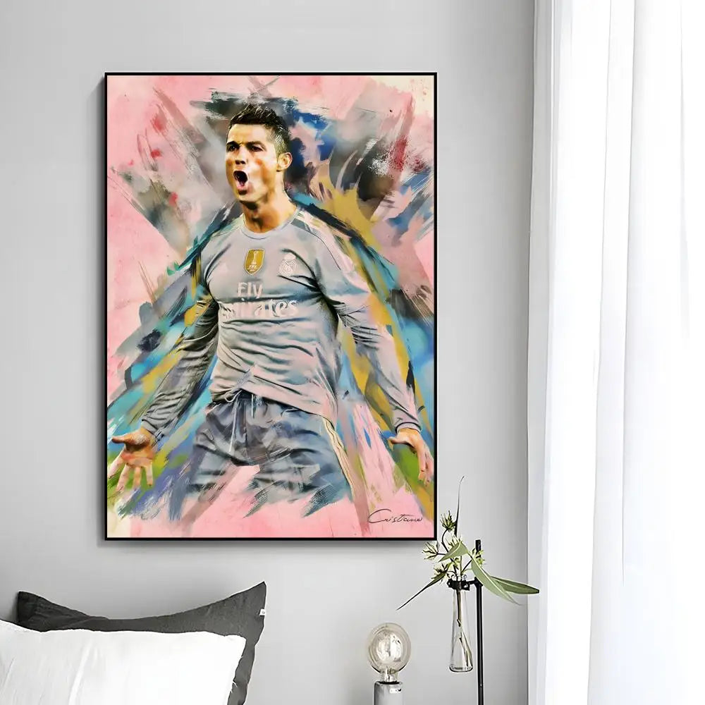 A modern wall art print featuring a painting of Cristiano Ronaldo celebrating with vibrant pink, blue, and yellow brushstroke