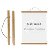 A rectangular art frame with a light wood border and a white mat, featuring the text Teak Wood.