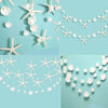 Light blue streamers shaped like starfish and jellyfish in iridescent white and silver colors