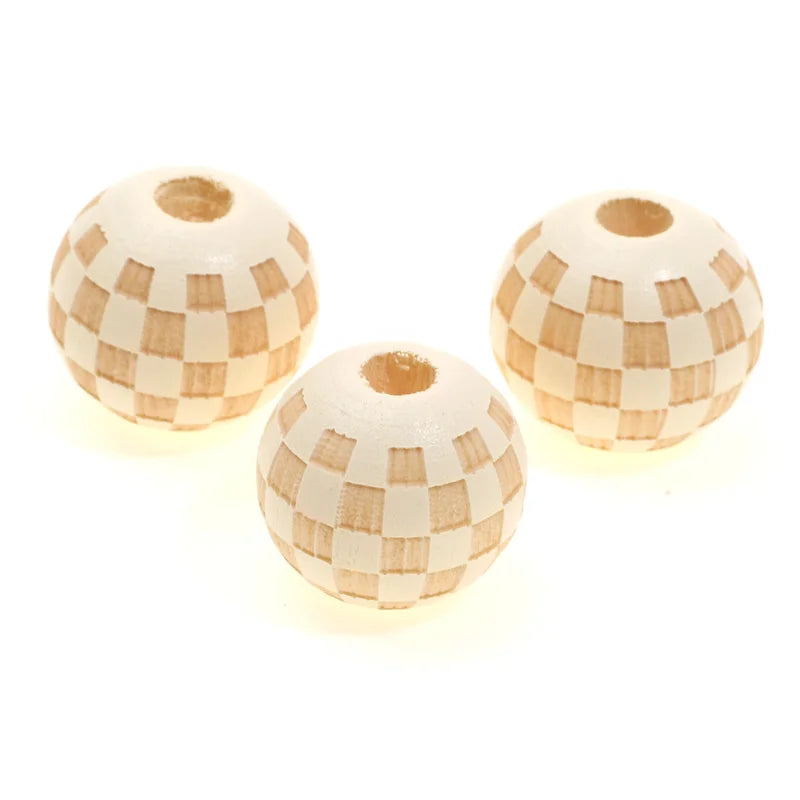 Three natural wooden checkered beads for jewelry making, round and textured.