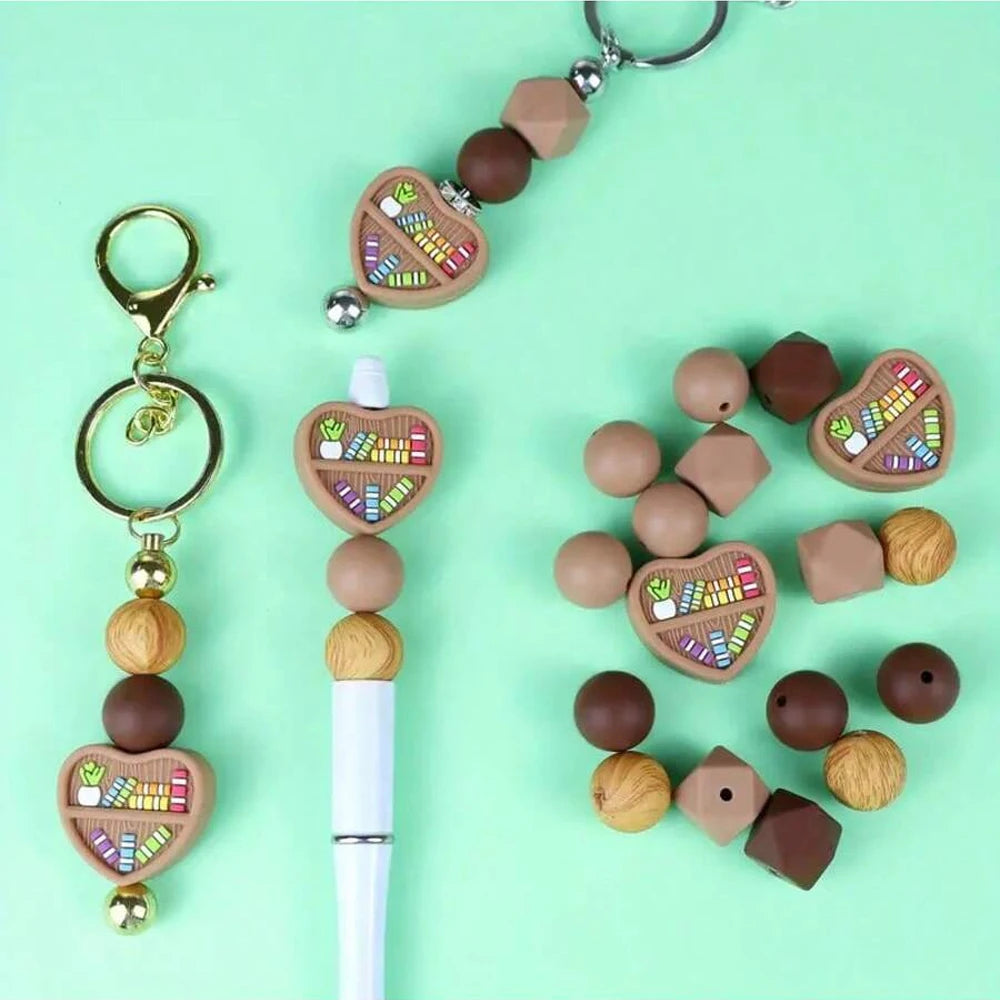 A necklace featuring silicone bookshelf beads in various natural and earthy tones.