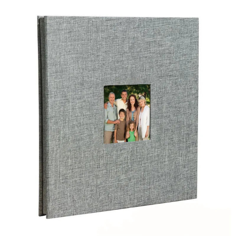 A grey linen front scrapbook memory book with a photo of a family.