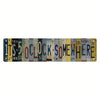 A rustic metal sign featuring the text '1TS 5 OCLOCK SOMEWHERE HERE' in distressed lettering.