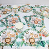 A set of safari jungle themed tableware including plates, cups, and napkins with animal illustrations.