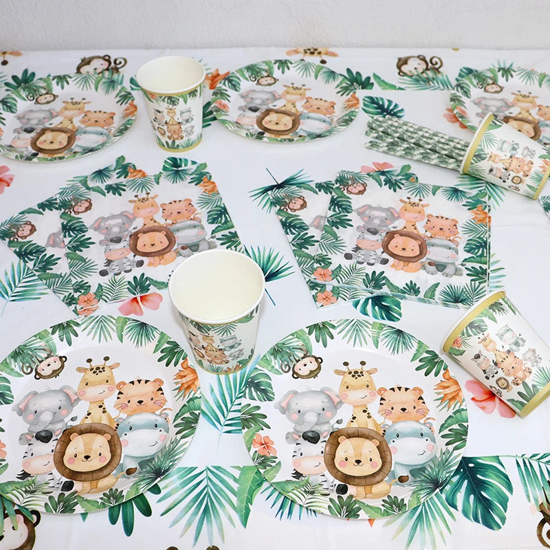 A set of safari jungle themed tableware including plates, cups, and napkins with animal illustrations.
