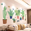 A wall decal featuring a green cactus and various colorful butterflies on a white wall.
