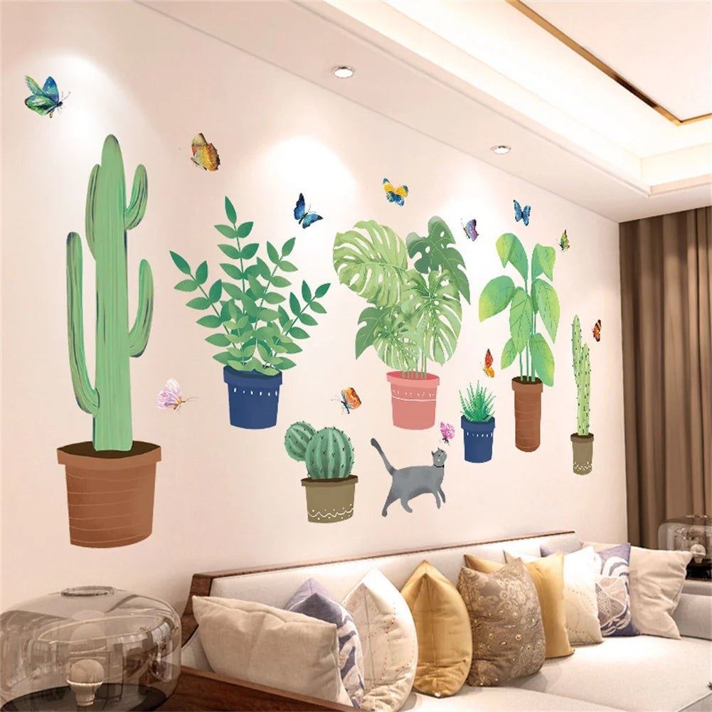 A wall decal featuring a green cactus and various colorful butterflies on a white wall.