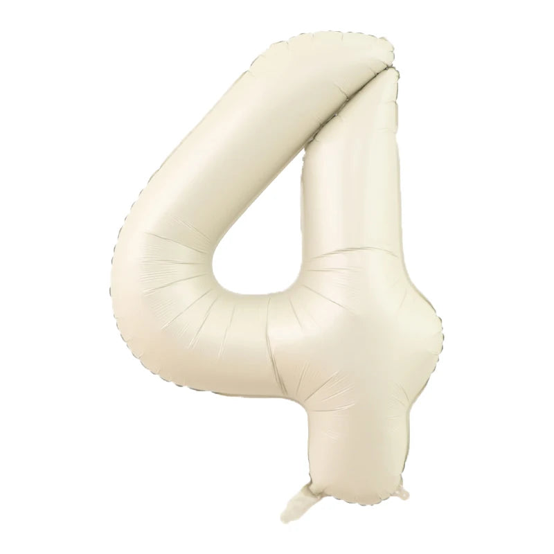 A beige foil number balloon shaped like the numeral 4.