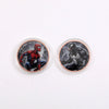 Two round challenge coins featuring designs of Spider-Man and the Grim Reaper.