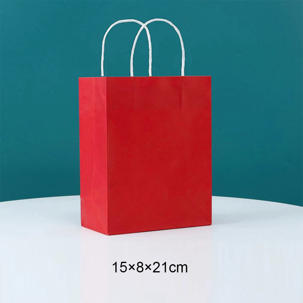 A red paper gift bag with white handles is displayed against a teal background.