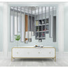 Modern home decor featuring a white cabinet and a wall with vertical acrylic mirror strips.
