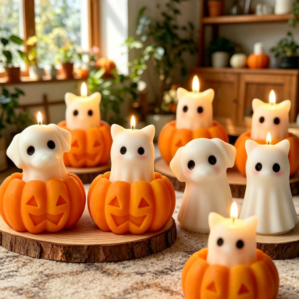 A collection of silicone candle molds featuring cute ghost, cat, dog, and pumpkin designs, some lit with candles.