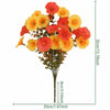 A bouquet of artificial pansy flowers in shades of orange and red with green eucalyptus stems.