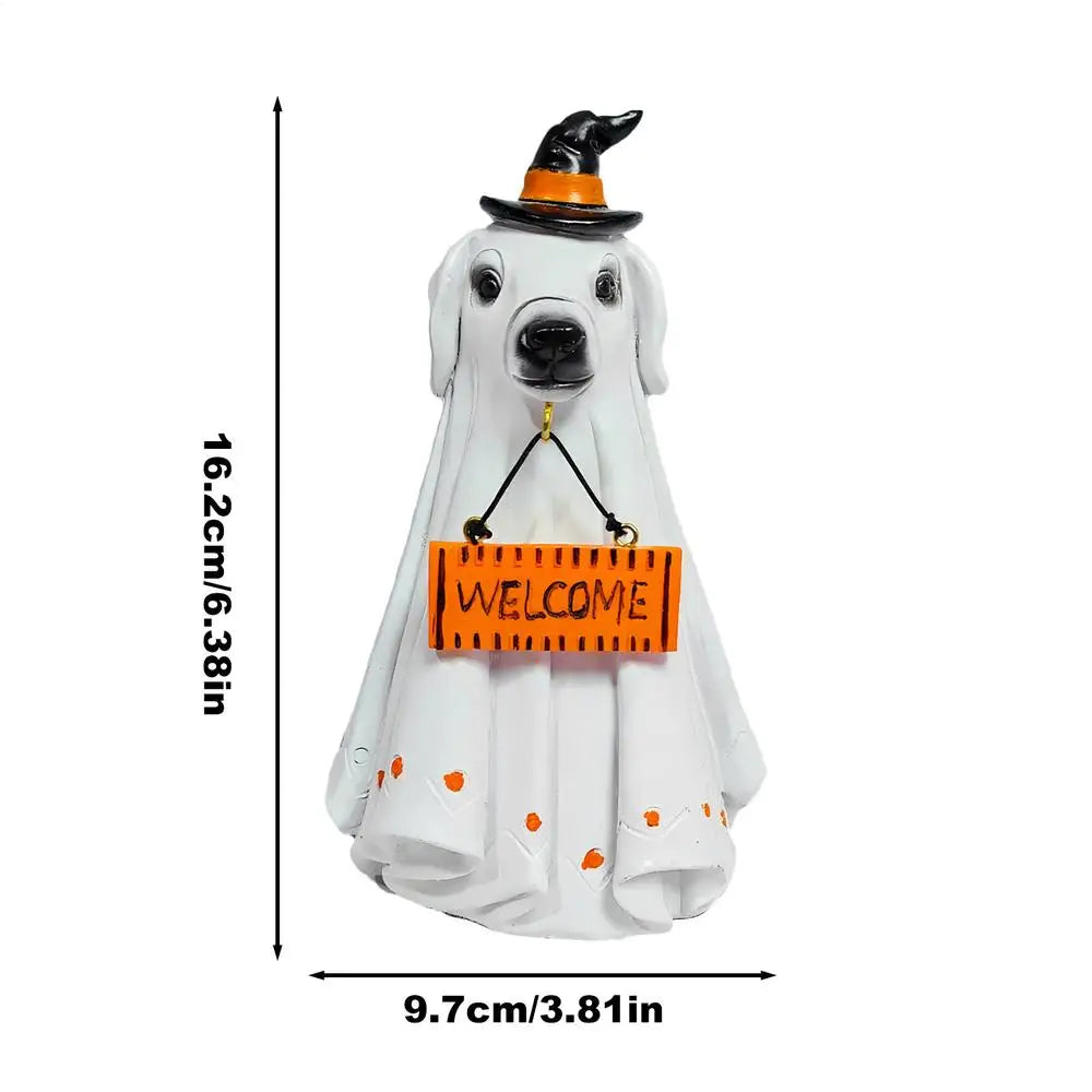 A white ghost figurine wearing a witch hat and a yellow welcome sign for Halloween decor