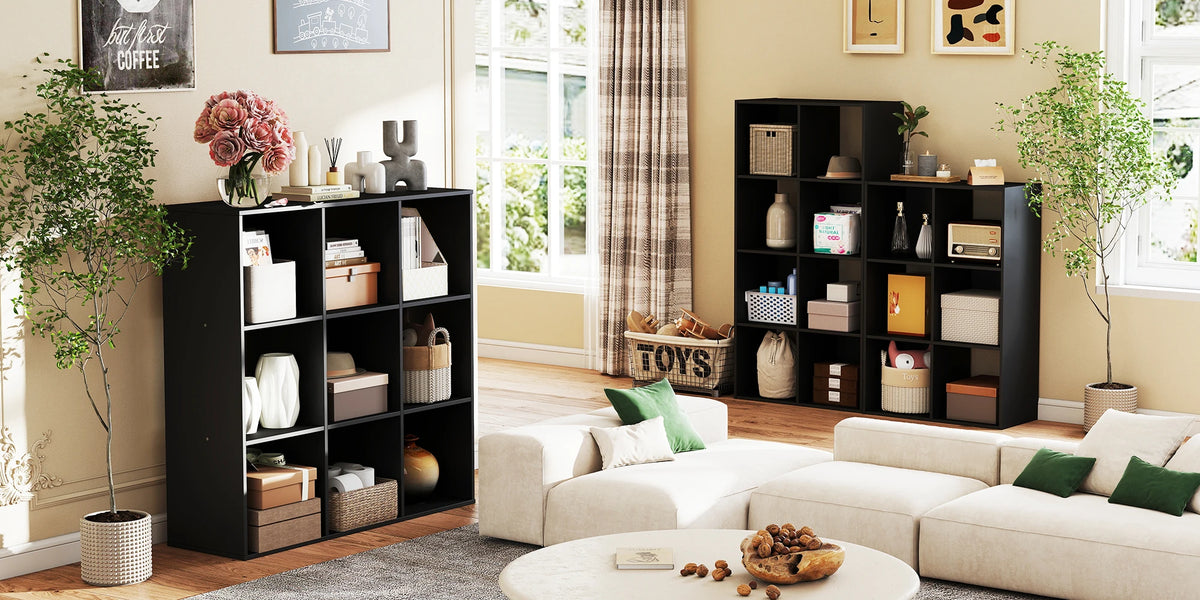 A black wooden storage organizer bookcase with open shelves and various decorative items in a bright room.