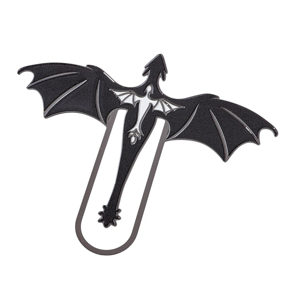 A black metal bookmark shaped like a four-winged dragon.