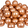 A close-up view of a 50-pack of chrome metallic balloons in various shades of rose gold and copper.