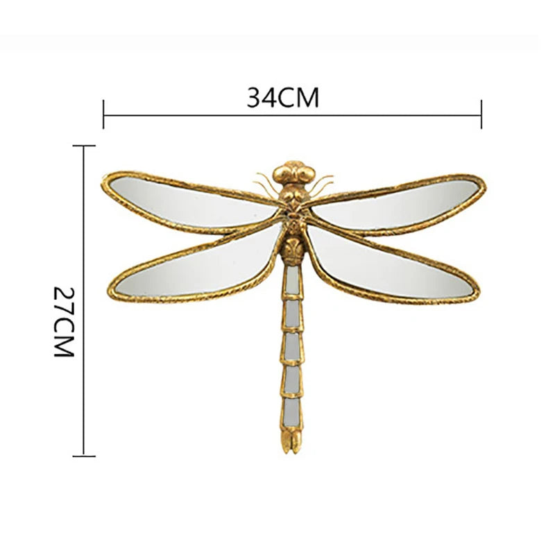 Artisan butterfly wall mirror with an antique gold frame, measuring 34cm long.